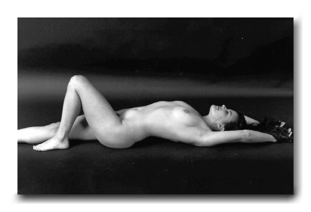 black and white photograph nude woman lying