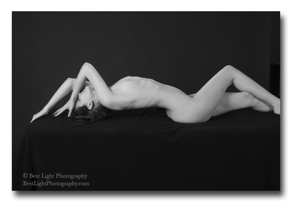 black and white photograph nude girl lying on back