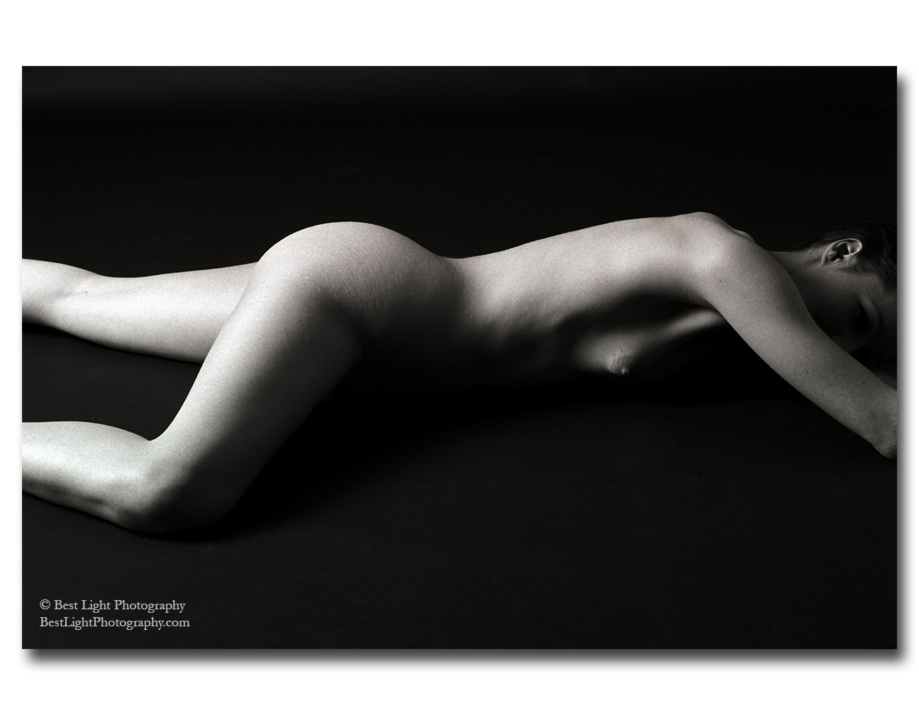 black and white photograph nude girl lying sprawled