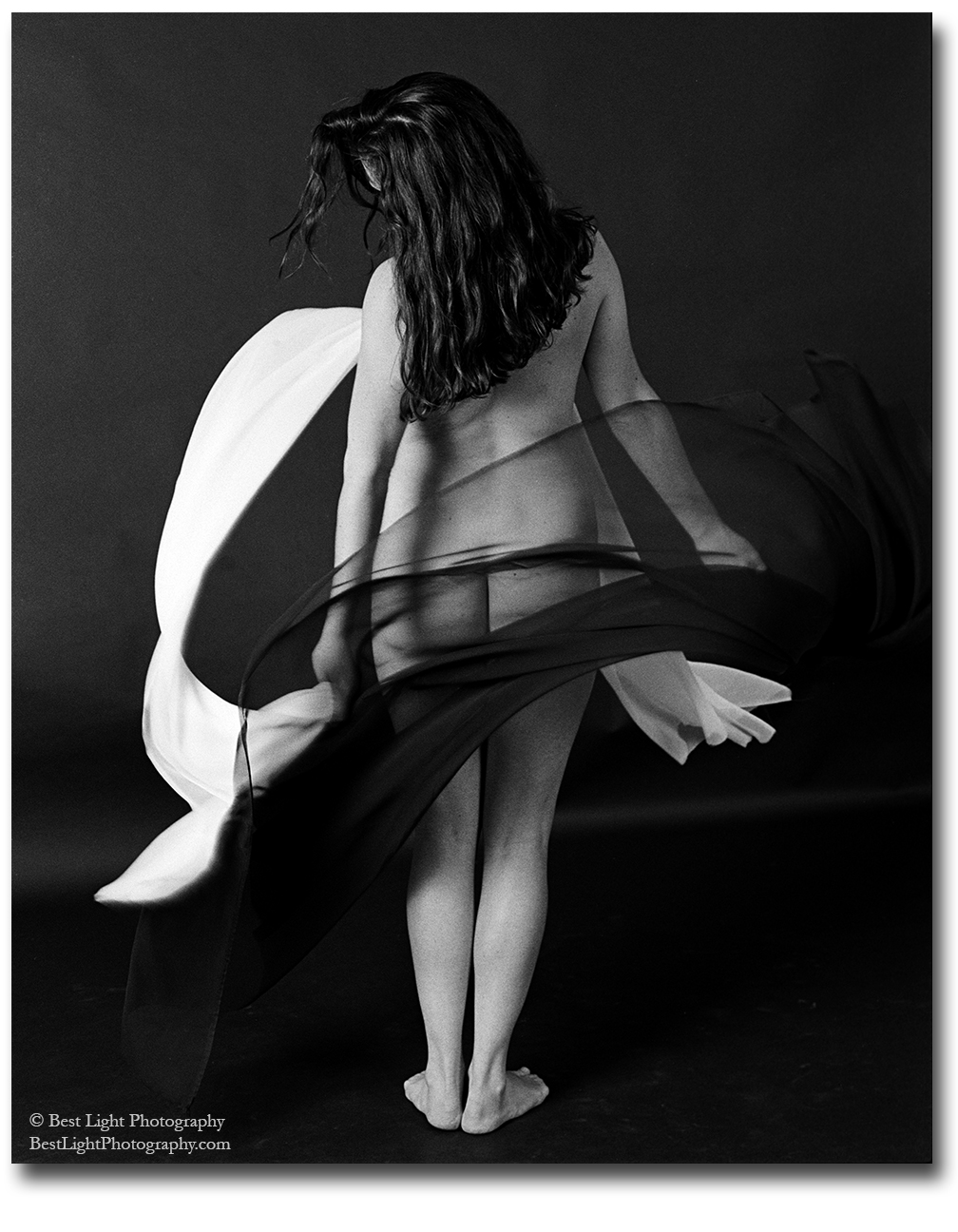 black and white photograph nude girl standing with flowing veils